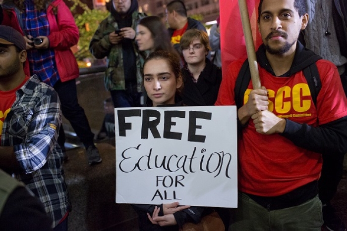 Student activists in New York City demand free tuition and cancellation of student debt. (Photo by Andrew Lichtenstein/Corbis via Getty Images)