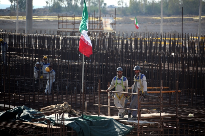 A picture taken on November 10, 2019, shows workers on a construction site in Iran's Bushehr nuclear power plant during an official ceremony to kick-start works for a second reactor at the facility. - Bushehr is Iran's only nuclear power station and is currently running on imported fuel from Russia that is closely monitored by the UN's International Atomic Energy Agency. (Getty Images)  