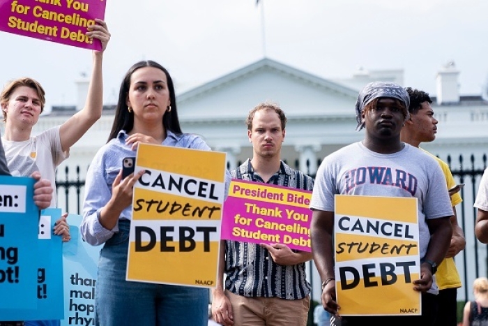Activists rally in support of cancelling student debt in front of the White House on August 25, 2022. (Photo by STEFANI REYNOLDS/AFP via Getty Images)