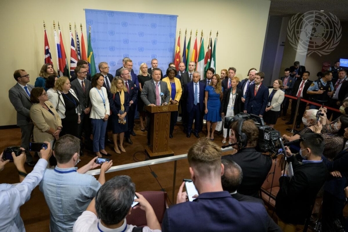 Flanked by fellow U.N. ambassadors, Ukrainian Ambassador Sergiy Kyslytsya reads out a joint statement after a U.N. Security Council meeting on Wednesday. (UN Photo/Manuel Elías)