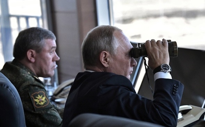 President Vladimir Putin and chief of the Russian general staff Gen. Valery Gerasimov observe a previous Vostok joint exercise, near the Chinese border in Siberia in 2018. (Photo by Alexey Nikolsky/AFP ia Getty Images)