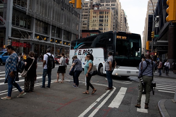 A busload of illegal border-crossers arrives in New York City from El Paso, Texas on August 29, 2022. (Photo by Andrew Lichtenstein/Corbis via Getty Images)