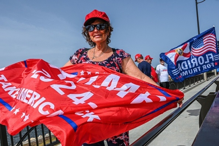 Supporters of former President Donald Trump gather near his Palm Beach residence on August 9, 2022. (Photo by GIORGIO VIERA/AFP via Getty Images)