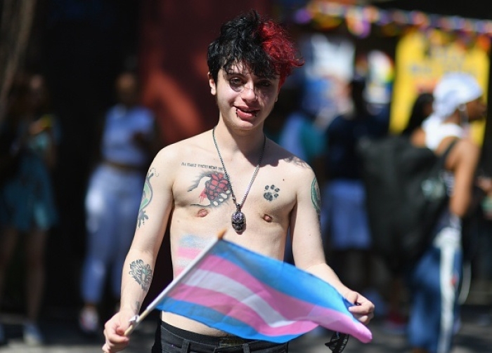Transgender boy naming himself as Damian takes part in the NYC Pride March in 2019. (Photo by ANGELA WEISS/AFP via Getty Images)