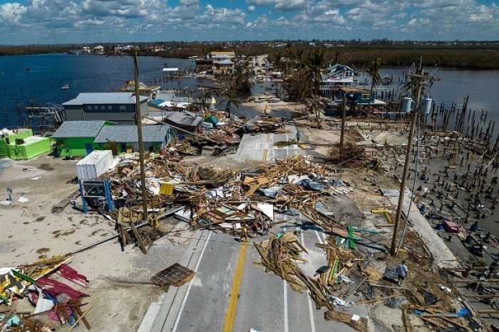 An aerial picture taken on October 1, 2022 shows a broken section of the Pine Island Road, debris and destroyed houses in the aftermath of Hurricane Ian in Matlacha, Florida. (Photo by RICARDO ARDUENGO/AFP via Getty Images)