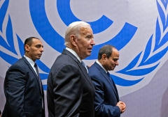 President Joe Biden (C) and his Egyptian counterpart Abdel Fattah El-Sisi (R) are pictured during the COP27 summit in Egypt's Red Sea resort city of Sharm el-Sheikh, on November 11, 2022. - Biden arrived at UN climate talks in Egypt today, armed with major domestic achievements against global warming but under pressure to do more for countries reeling from natural disasters (Photo by SAUL LOEB/AFP via Getty Images)
